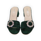 ARQS.PK 589N emerald green velvet block heel mules featuring a decorative circular crystal-embellished buckle.