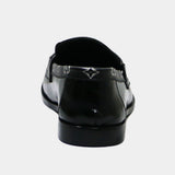 ARQS.PK 727 black leather loafers featuring a patterned trim detail, shown from a rear angle.