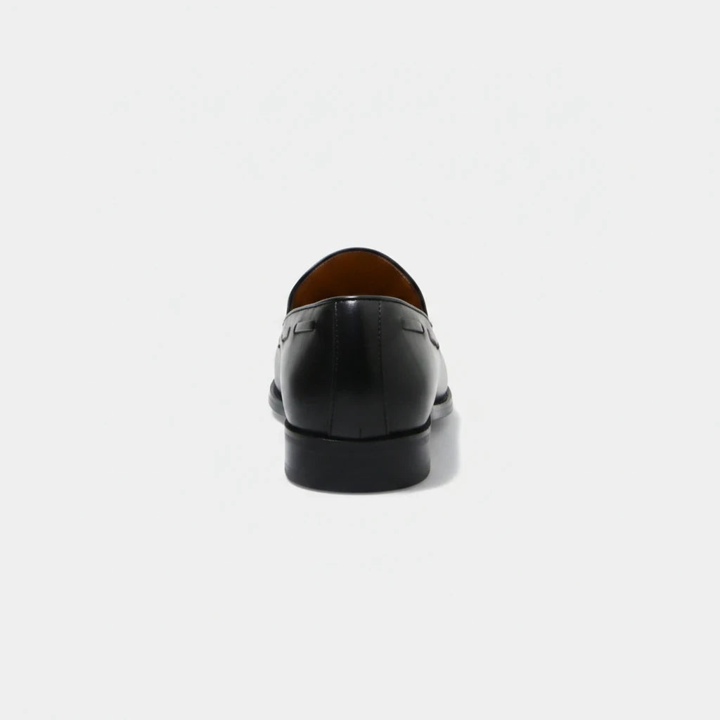 ARQS.PK 761N black leather loafers viewed from the back, showcasing a sleek heel and minimalist design.