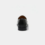 ARQS.PK 761N black leather loafers viewed from the back, showcasing a sleek heel and minimalist design.