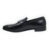 ARQS.PK black formal leather loafer with a sleek slip-on design and metallic strap detail on the vamp