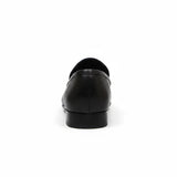 Back view of ARQS.PK black textured leather slip-on loafers with a low-profile heel on a white background.
