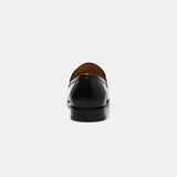 Rear view of ARQS.PK black leather penny loafer dress shoe with a smooth finish and durable heel