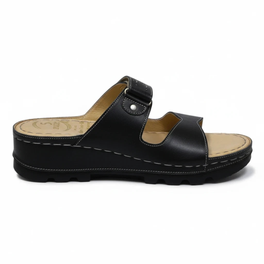 ARQS.PK black platform slide sandals with dual straps, metallic stud accents, and a cushioned reflex-zone footbed.