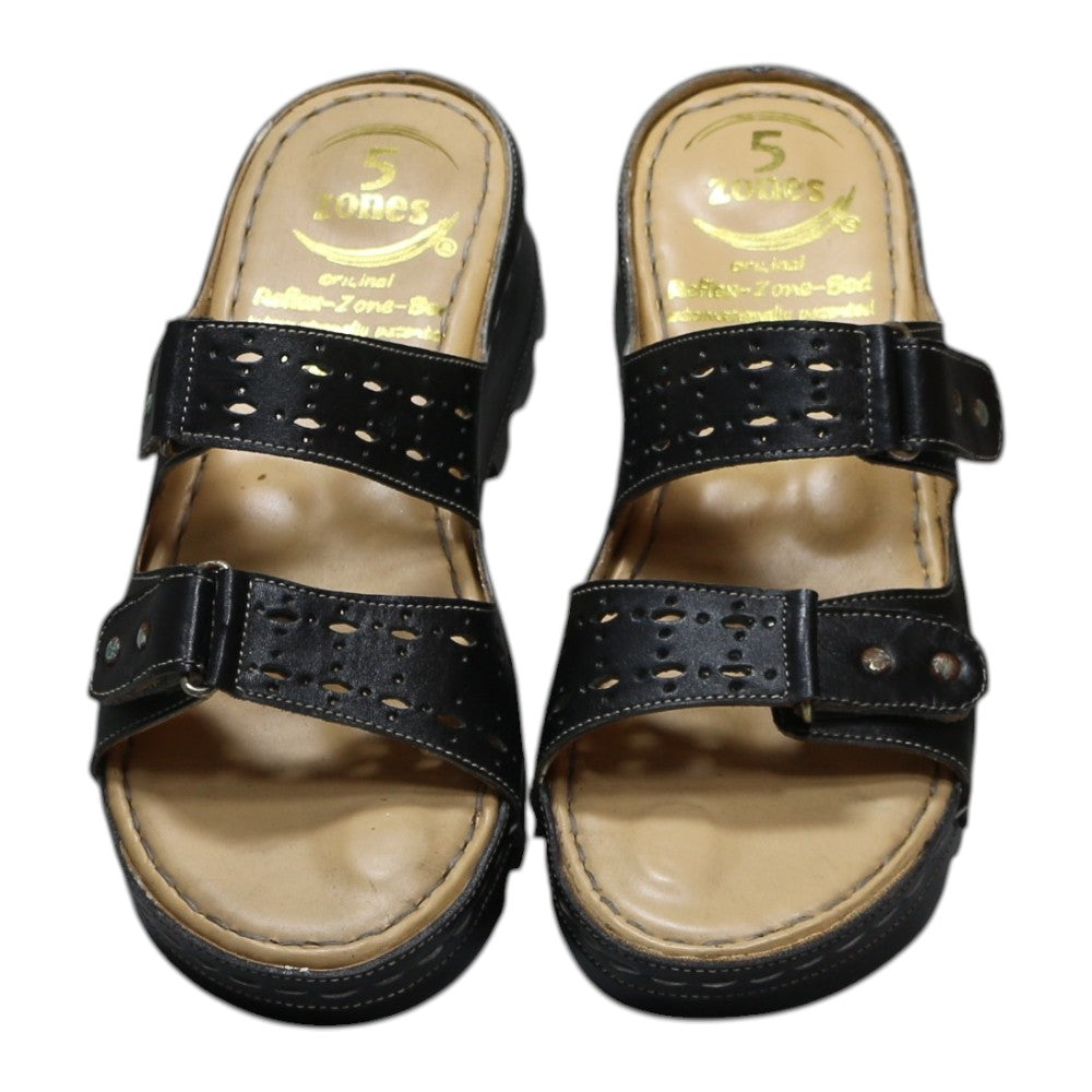ARQS.PK black platform slide sandals with dual straps, cut-out details, metallic studs, and reflex-zone footbed.