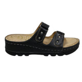 ARQS.PK black platform slide sandals with dual straps, metallic stud accents, and a cushioned reflex-zone footbed.