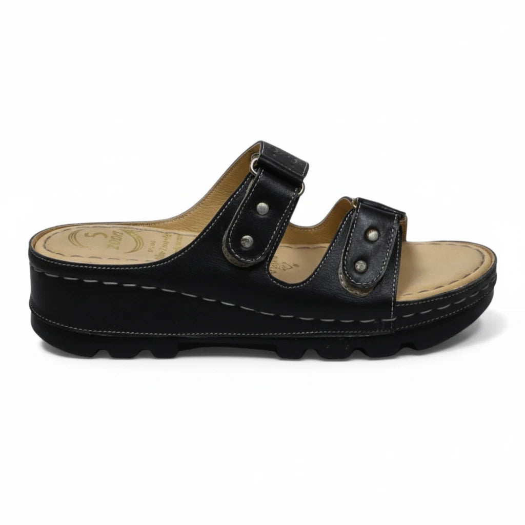 ARQS.PK black platform slide sandals with dual straps, metallic stud accents, and a cushioned reflex-zone footbed.