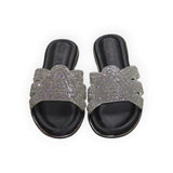 ARQS.PK black flat slide sandals featuring multi-strap detailing with shimmering rhinestone embellishments.