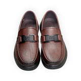 ARQS.PK 1710 brown textured leather loafers with a black metal buckle detail and thick rubber sole