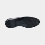 ARQS.PK black leather loafer shoe featuring a durable textured rubber outsole for high traction and stability.