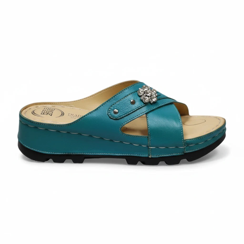 ARQS.PK teal orthopedic slide sandals with crisscross straps, crystal embellishment, and cushioned platform sole.