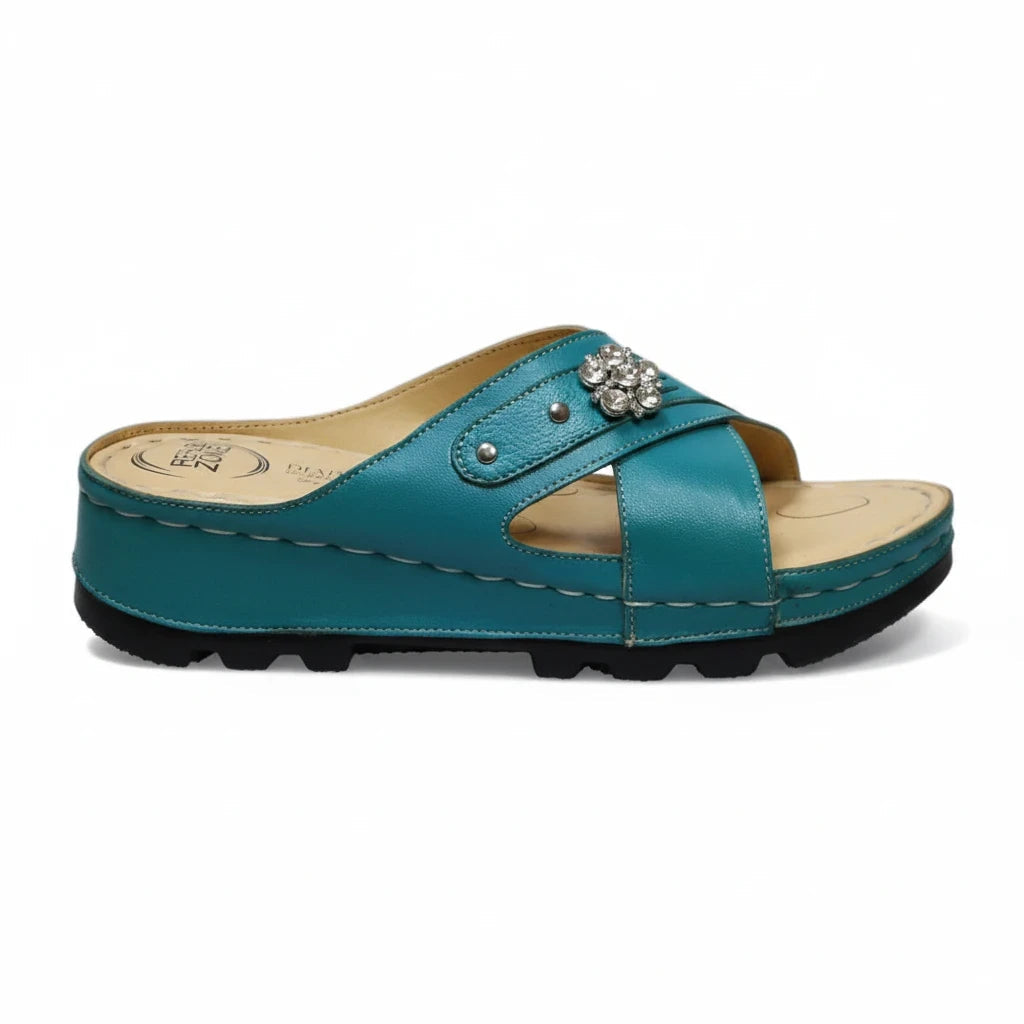 ARQS.PK teal orthopedic slide sandals with crisscross straps, crystal embellishment, and cushioned platform sole.